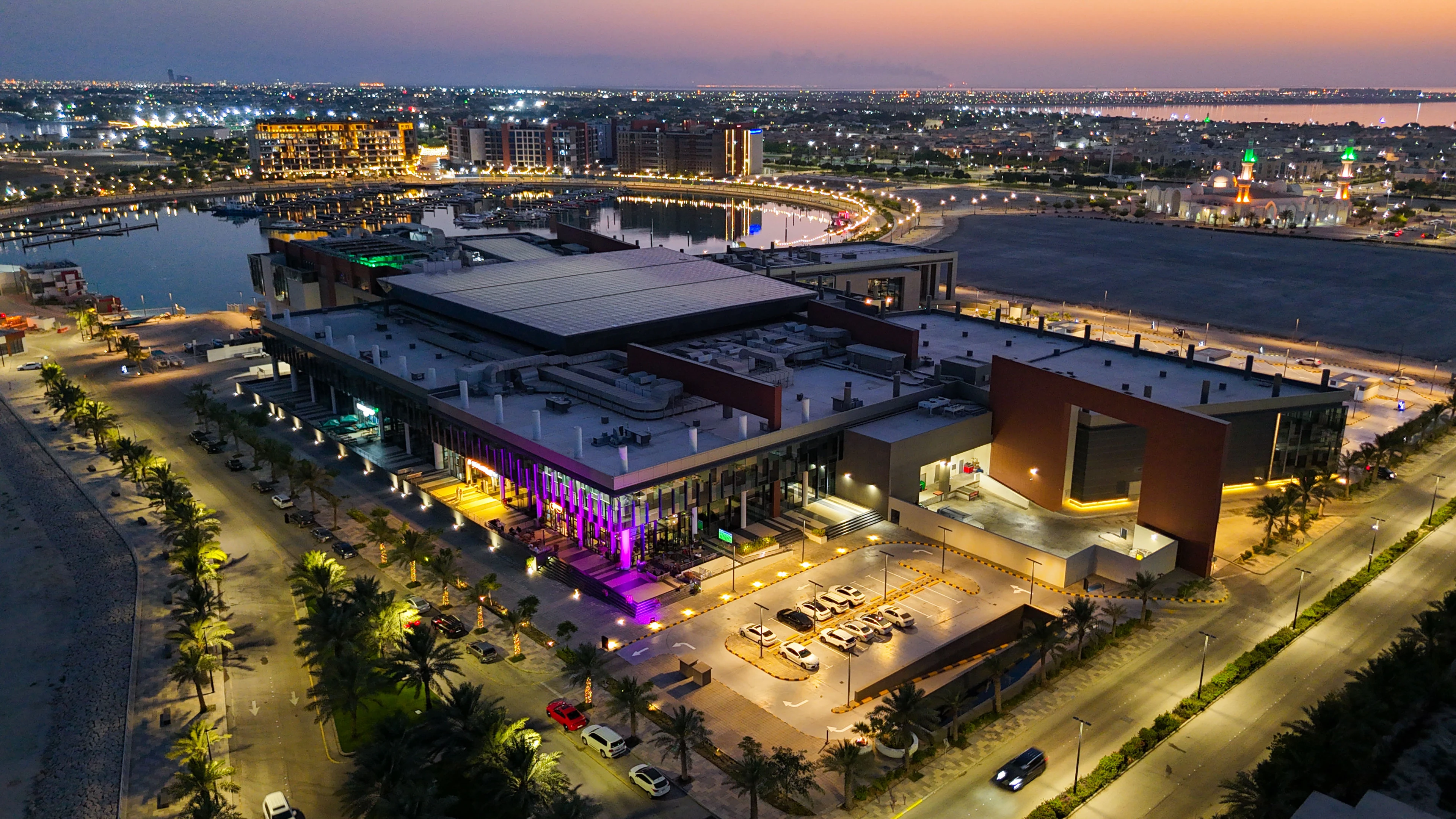 Jubail Bay waterfront and marina illuminated at dusk